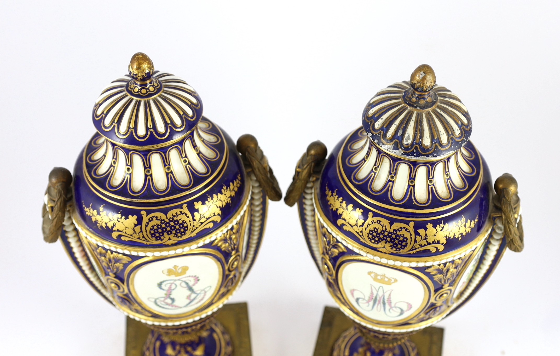 A pair of English porcelain Sevres style ormolu mounted vases and covers, mid 19th century, 44cm high, one replacement cover